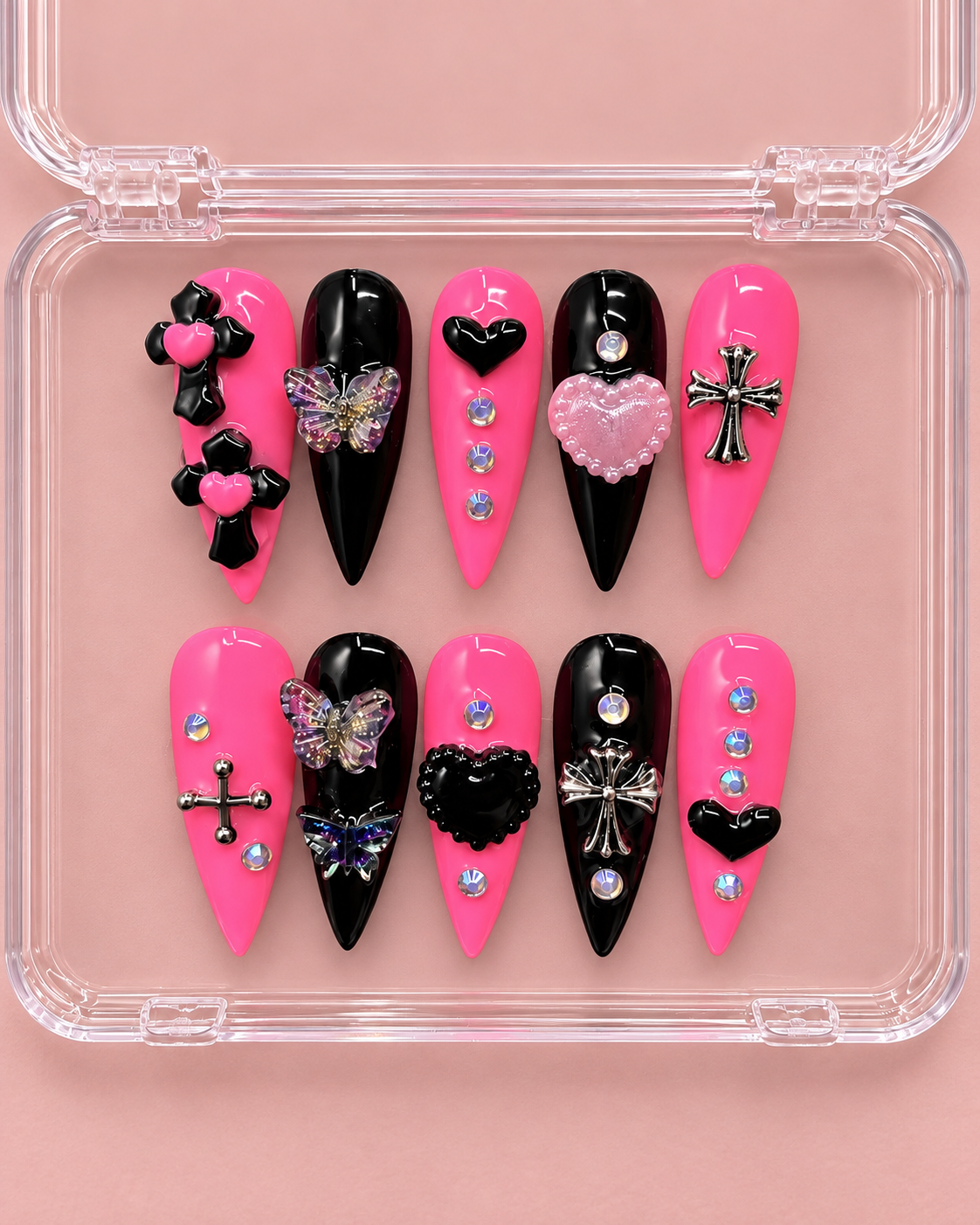 Pink and black handmade press-on nails with statement charms